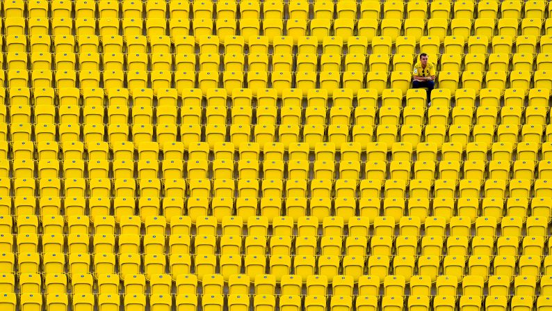 A supporter of the Spanish soccer club Las Palmas sits in the stands before a home match against Real Madrid on Saturday, September 24.