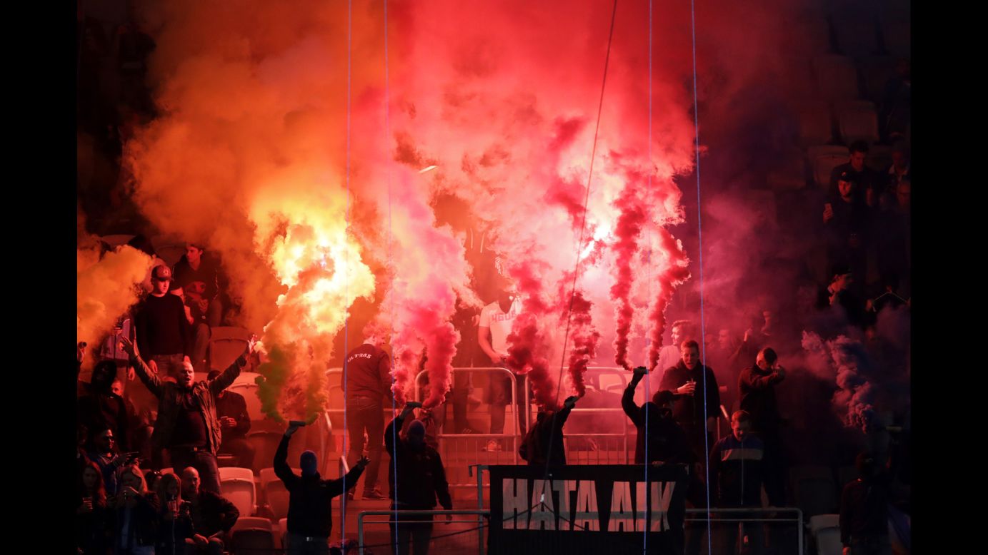 Flares are lit by Djurgardens fans during a Swedish soccer match in Stockholm on Wednesday, September 21.