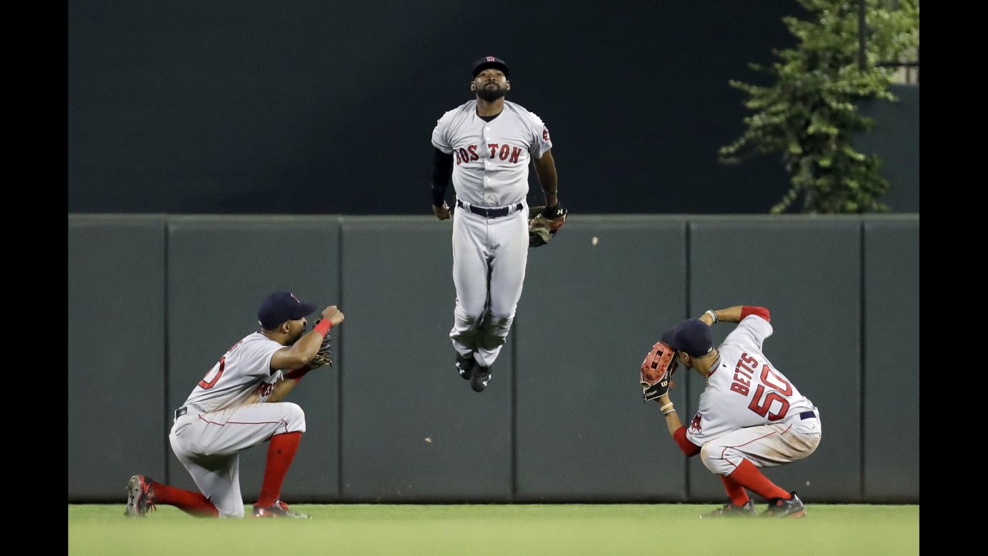 From left, Boston outfielders Chris Young, Jackie Bradley Jr. and Mookie Betts celebrate a win in Baltimore on Tuesday, September 20.