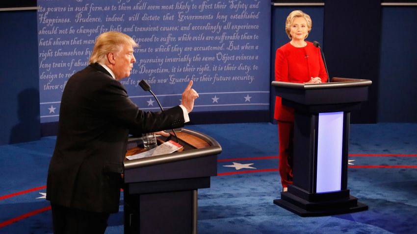 Donald Trump (L) speaks as Hillary Clinton (R) listens during the Presidential Debate at Hofstra University on September 26, 2016 in Hempstead, New York.