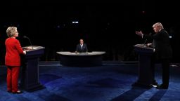 Donald Trump (R) speaks as Hillary Clinton and Moderator Lester Holt listen during the Presidential Debate at Hofstra University on September 26, 2016 in Hempstead, New York. 