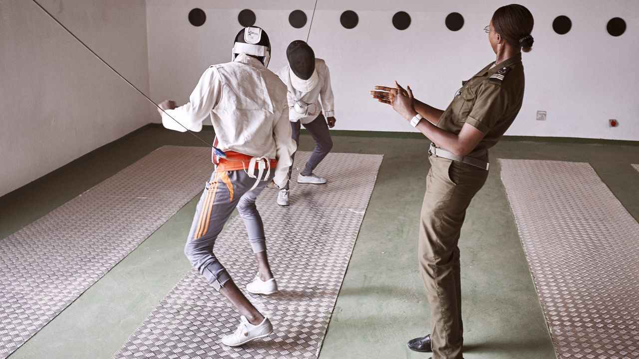 Prison guard Fatoumata Sy referees a fencing match between minors.
