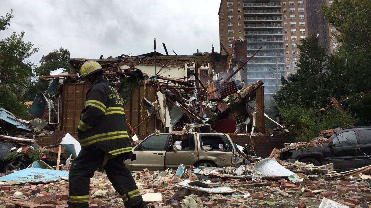 A firefighter at the scene of a Bronx building explosion that killed a battalion chief and injured 20.