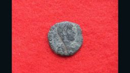 The front of a Roman coin.