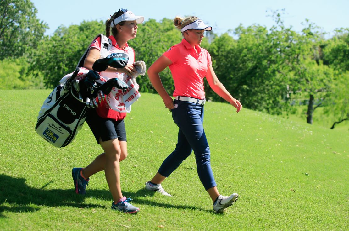 Sister act: Brittany (left) caddies for Brooke.