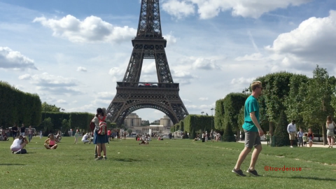 Travis showing off  his skills outside the Eiffel Tower in Paris
