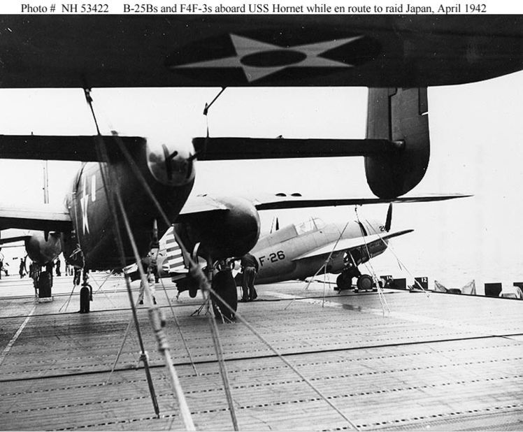 As the Hornet steamed toward Japan, the B-25 bombers, left, shared the deck with Navy Wildcat fighter planes, right. The B-25s had "tricycle" landing gear different from so-called "tail-draggers," like the Wildcats, which had small wheels that supported the tail. 