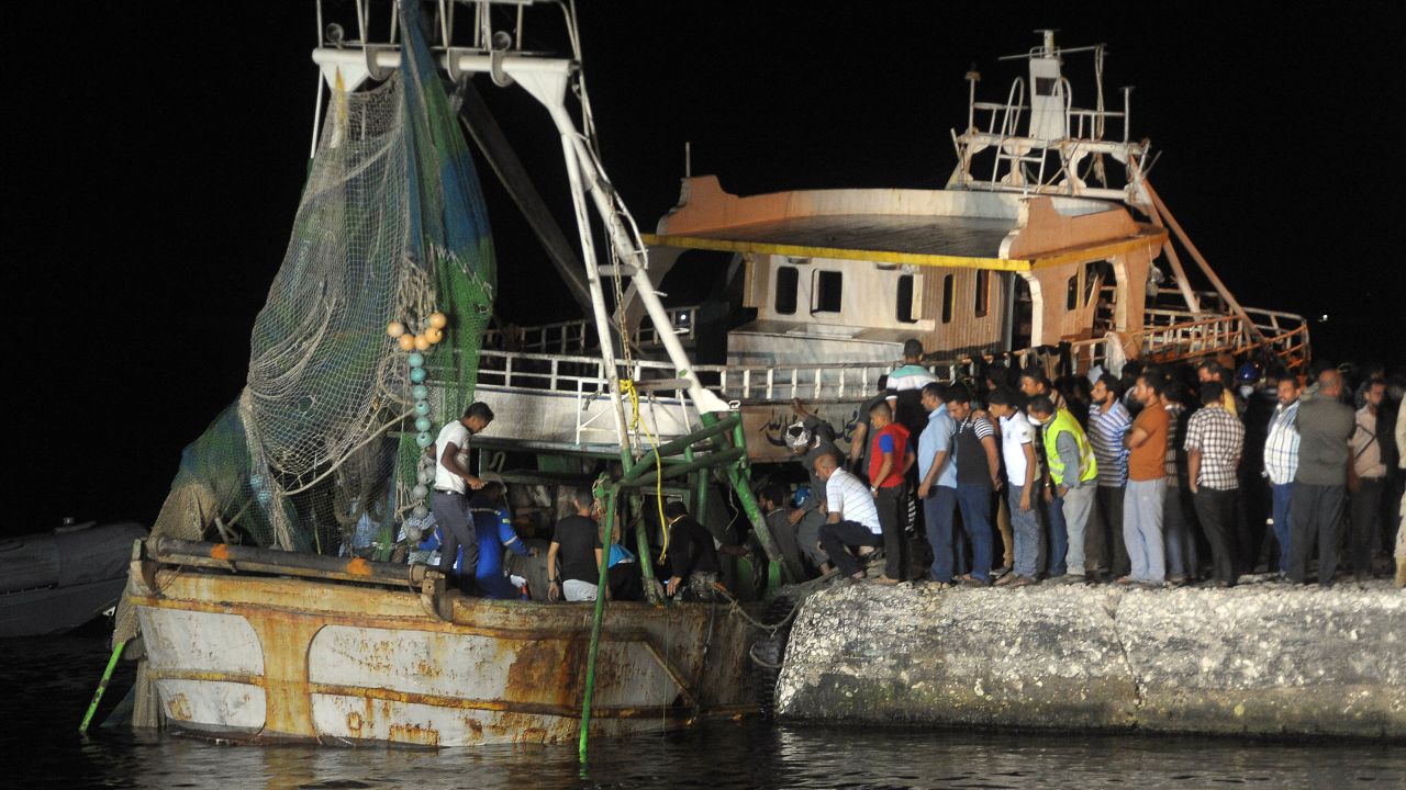 The wreck of the capsized migrant boat arrives in Rosetta