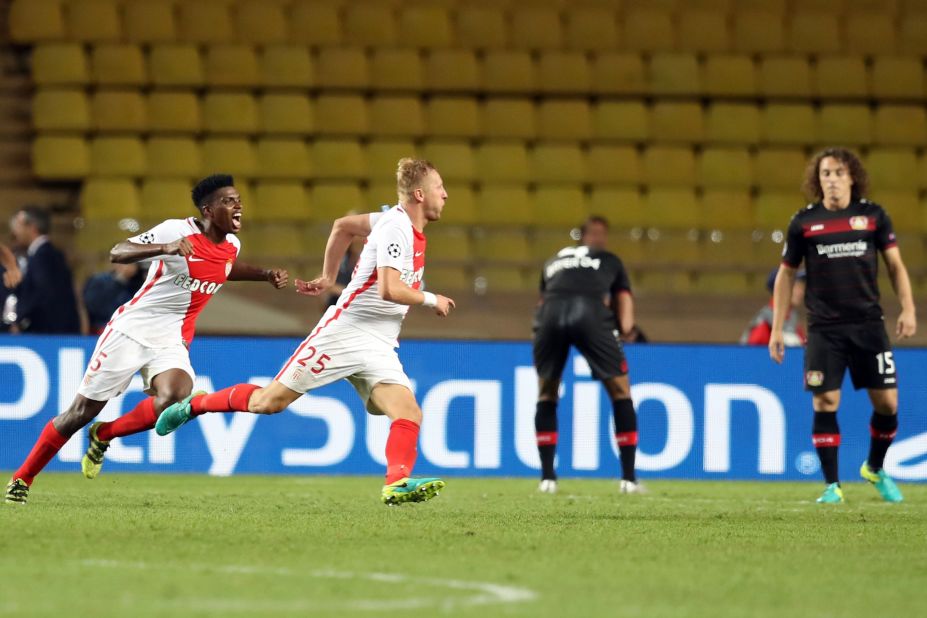 Kamil Glik celebrates after smashing home a late equaliser in  Monaco's Champions League game against Bayer Leverkusen, but only 8,100 fans attended the game.
