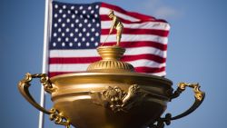 The American flag flies behind a statue of the Ryder Cup trophy at Hazeltine National Golf Course in Chaska, Minnesota, September 26, 2016, ahead of the 41st Ryder Cup. / AFP / JIM WATSON        (Photo credit should read JIM WATSON/AFP/Getty Images)