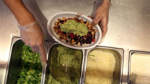 MIAMI, FL - APRIL 27: Chipotle restaurant workers fill orders for customers on the day that the company announced it will only use non-GMO ingredients in its food on April 27, 2015 in Miami, Florida. The company announced, that the Denver-based chain would not use the GMO's, which is an organism whose genome has been altered via genetic engineering in the food served at Chipotle Mexican Grills. (Photo by Joe Raedle/Getty Images)