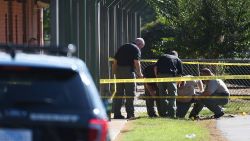 Members of law enforcement investigate an area at Townville Elementary School on Wednesday, September 28 in Townville, South Carolina.  A teenager opened fire at the South Carolina elementary school Wednesday, wounding two students and a teacher before the suspect was taken into custody, authorities said.