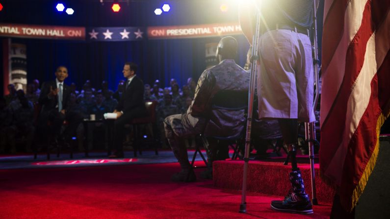 U.S. President Barack Obama answers a question from Marine Cpl. Brandon Rumbaugh during <a href="http://www.cnn.com/2016/09/28/politics/gallery/obama-town-hall/index.html" target="_blank">a town-hall event</a> in Fort Lee, Virginia, on Wednesday, September 28. Rumbaugh lost both of his legs during his second deployment to Afghanistan. He was one of <a href="http://www.cnn.com/2016/09/28/politics/highlights-questions-obama-presidential-town-hall-military/" target="_blank">several service members who asked questions</a> during the forum, which focused on issues related to the military.