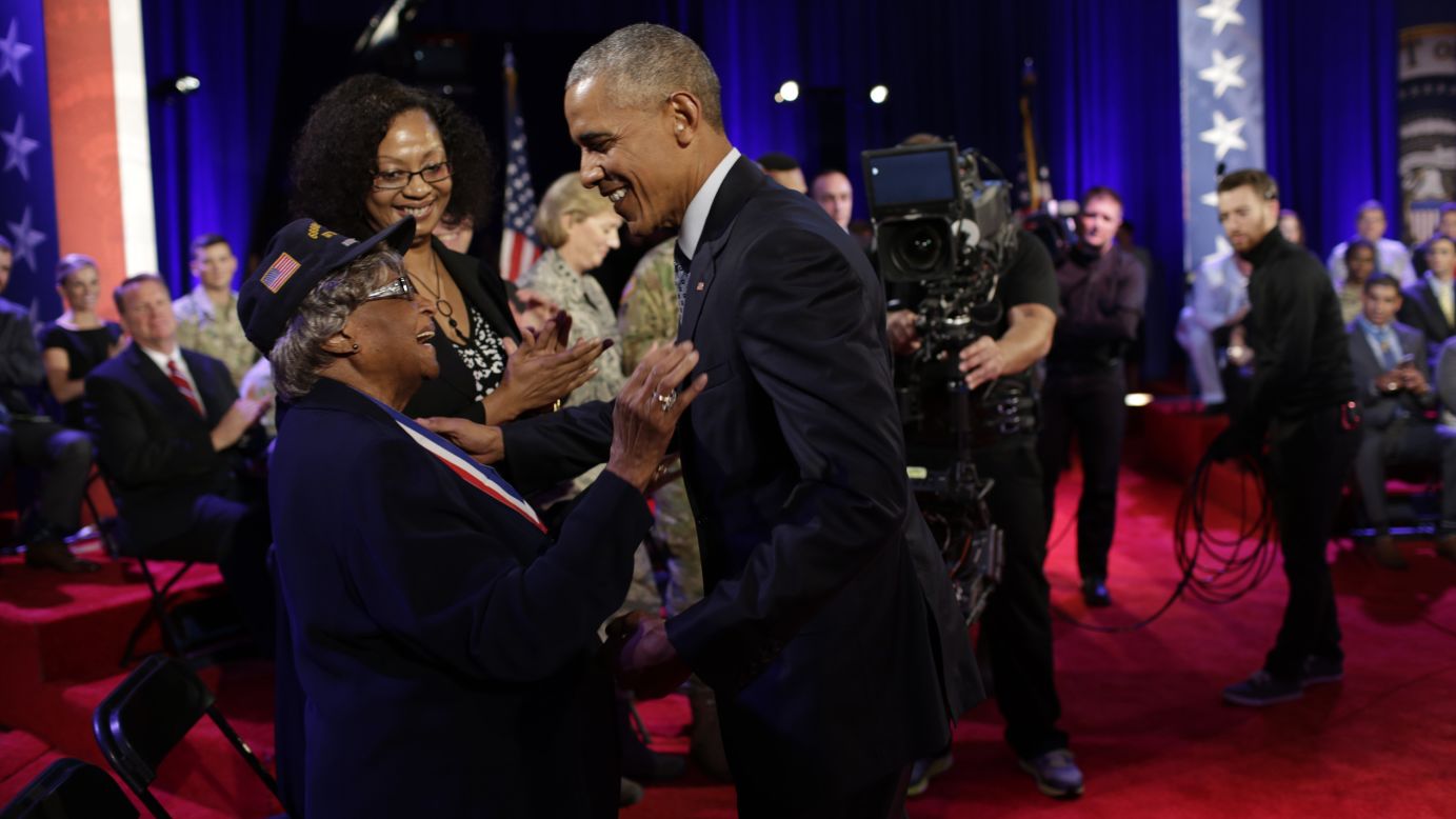 Obama greets World War II veteran Millie Veasey after the event.