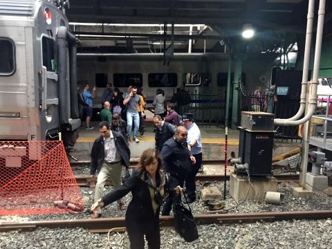 Passengers rush to safety after a train plowed into a platform at Hoboken station.     