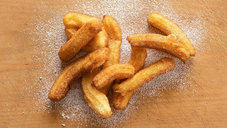 Few places make deep-fried dough pastry as finger-licking good as Spain. Often doused in sugar and dipped in hot melted chocolate, churros are a favorite during street festivals. (Image credit: "Quick & Easy Spanish Recipes" by Simone and Inés Ortega, Phaidon, <a href="index.php?page=&url=http%3A%2F%2Fphaidon.com" target="_blank" target="_blank">phaidon.com</a>)