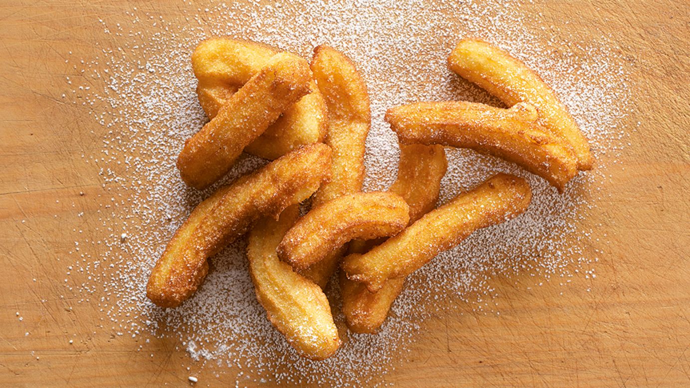 Few places make deep-fried dough pastry as finger-licking good as Spain. Often doused in sugar and dipped in hot melted chocolate, churros are a favorite during street festivals. (Image credit: "Quick & Easy Spanish Recipes" by Simone and Inés Ortega, Phaidon, <a href="http://phaidon.com" target="_blank" target="_blank">phaidon.com</a>)