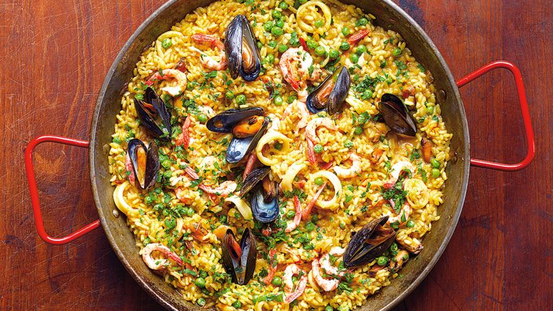 Originating in the region around Valencia, paella traditionally comes in two varieties: paella Valenciana (with rabbit and chicken) and seafood paella. (Image credit: "Quick & Easy Spanish Recipes" by Simone and Inés Ortega, Phaidon, <a href="index.php?page=&url=http%3A%2F%2Fphaidon.com" target="_blank" target="_blank">phaidon.com</a>)