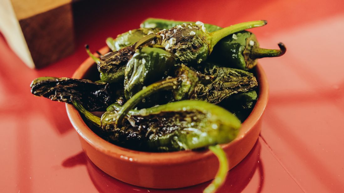 A perfect complement to a glass of rioja, these salted Padron peppers are addictively sweet, salty and sometimes fiery hot. 