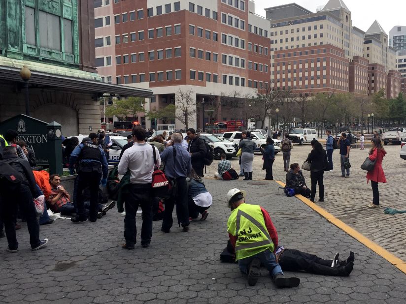 People are treated for their injuries outside the Hoboken  station.