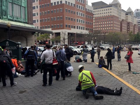 People are treated for their injuries outside the Hoboken  station.