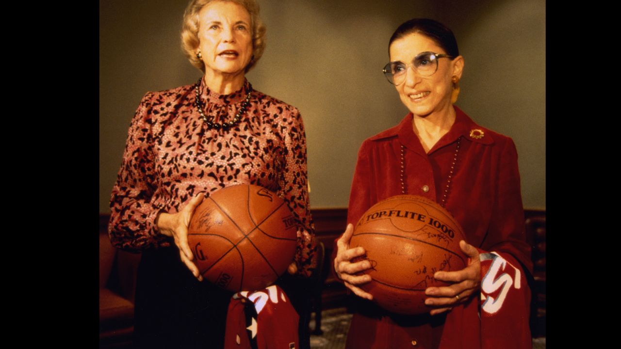 Justices Sandra Day O'Connor and Ruth Bader Ginsburg held basketballs that they received as gifts from the United States women's Olympic basketball team during the team's visit to the court on December 6, 1995.
