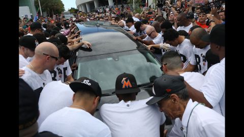 <strong>September 28:</strong> Baseball fans and members of the Miami Marlins organization surround the hearse carrying Marlins pitcher Jose Fernandez, <a href="http://www.cnn.com/2016/09/28/us/miami-jose-fernandez-procession/" target="_blank">who died in a boating accident.</a> Fernandez, a 24-year-old native of Santa Clara, Cuba, was a beloved figure in Miami, where so many of his countrymen have settled and prospered. He was a two-time All-Star and the National League's Rookie of the Year in 2013.