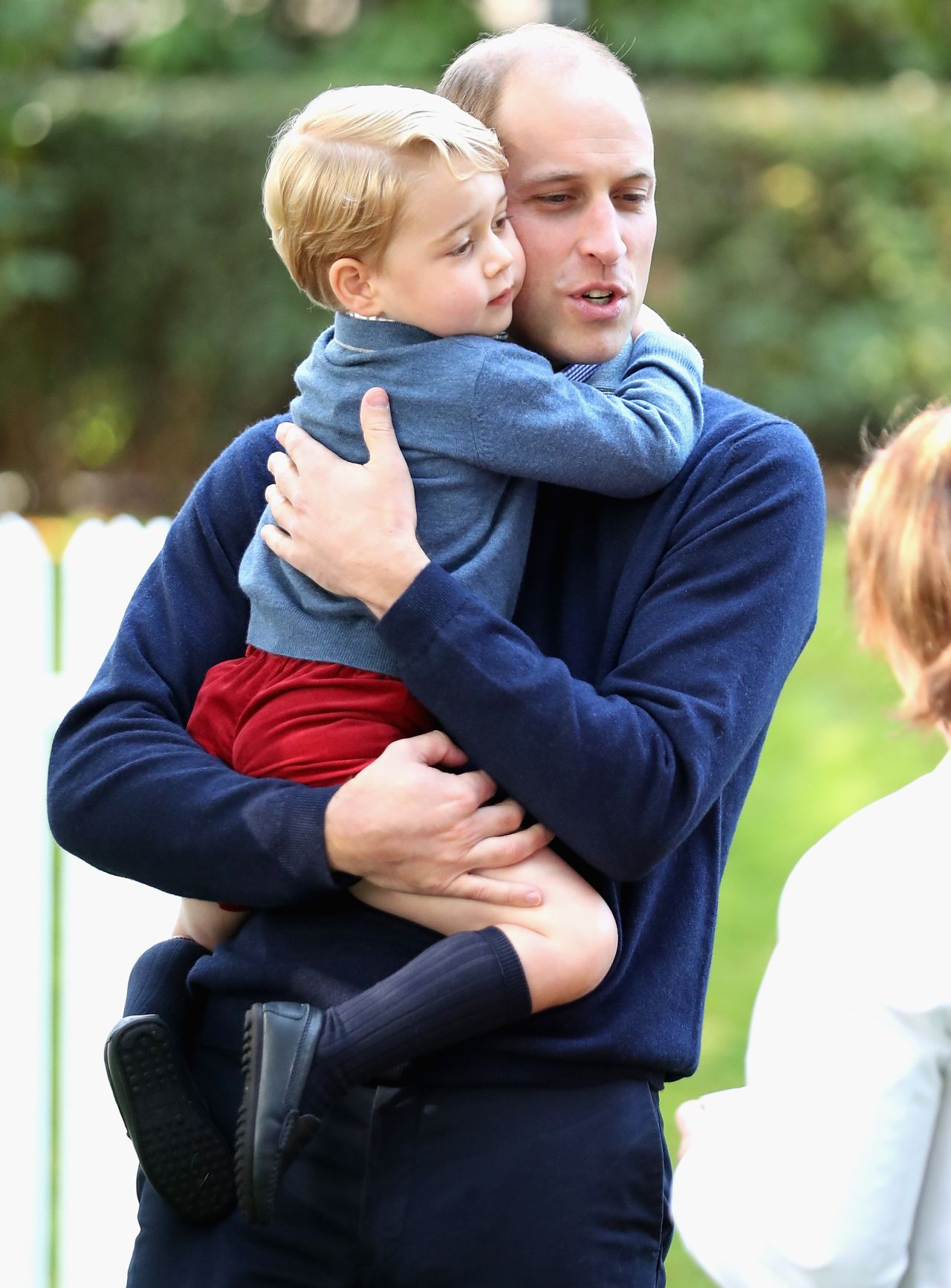 Prince William holds Prince George on September 29. 