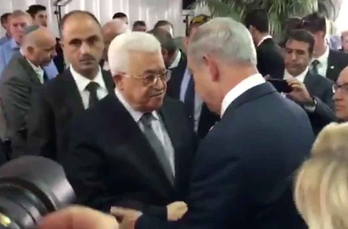 Palestinian President Mahmoud Abbas (left) shakes hands with Israeli Prime Minister Benjamin Netanyahu at the funeral of Shimon Peres.