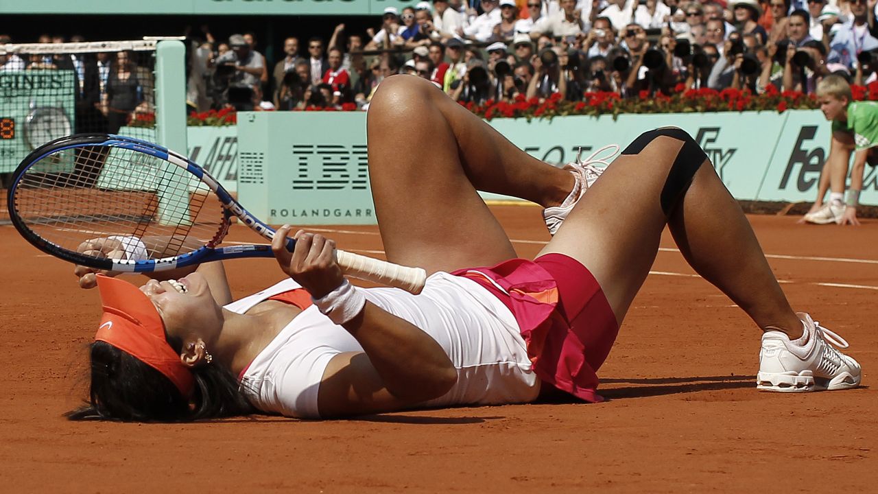 Li Na collapses in delight after winning the French Open in 2011.