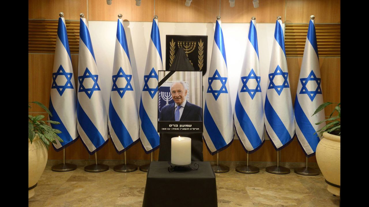 A portrait of Peres is displayed at the Knesset plaza in Jerusalem, where his body laid in state on Thursday, September 29.