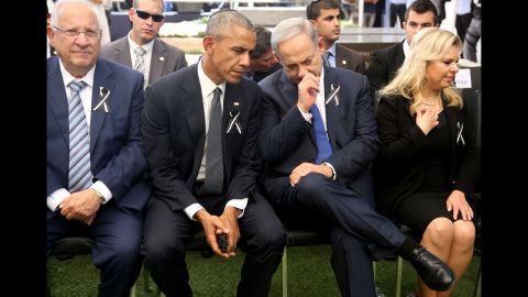 US President Barack Obama (C-L) talks with Israeli Prime Minister Benjamin Netanyahu (C-R) as they sit with Israeli President Reuven Rivlin (L) and Sara Netanyahu (R), the wife of the Israeli prime minister, at Jerusalem's Mount Herzl national cemetery during the funeral of former Israeli president Shimon Peres on September 30, 2016. / AFP / POOL / Menahem KAHANA (Photo credit should read MENAHEM KAHANA/AFP/Getty Images)