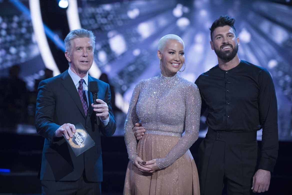 "Dancing with the Stars" contestant Amber Rose said she felt body shamed by judge Julianne Hough during her week 3 performance. Rose is shown here with co-host Tom Bergeron and partner Maksim Chmerkovskiy.