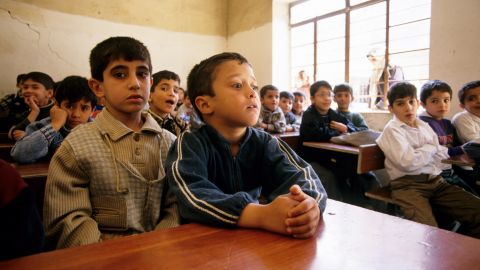 Children at a school in Mosul in 2002. ISIS developed its own curriculum after it took control of the city in 2014.