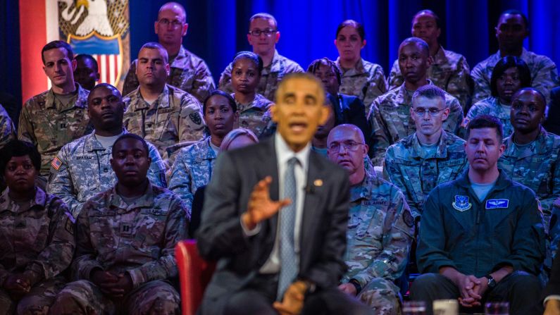 Military members watch U.S. President Barack Obama speak during <a href="index.php?page=&url=http%3A%2F%2Fwww.cnn.com%2F2016%2F09%2F28%2Fpolitics%2Fhighlights-questions-obama-presidential-town-hall-military%2F" target="_blank">a town-hall event</a> in Fort Lee, Virginia, on Wednesday, September 28. Obama answered questions from service members during the forum, which was hosted by CNN.