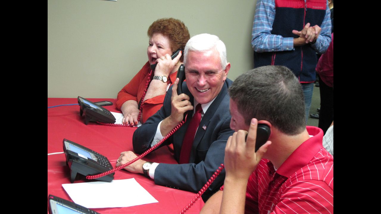 Indiana Gov. Mike Pence, Donald Trump's running mate, makes phone calls at a Republican Party office in Fitchburg, Wisconsin, on Tuesday, September 27.