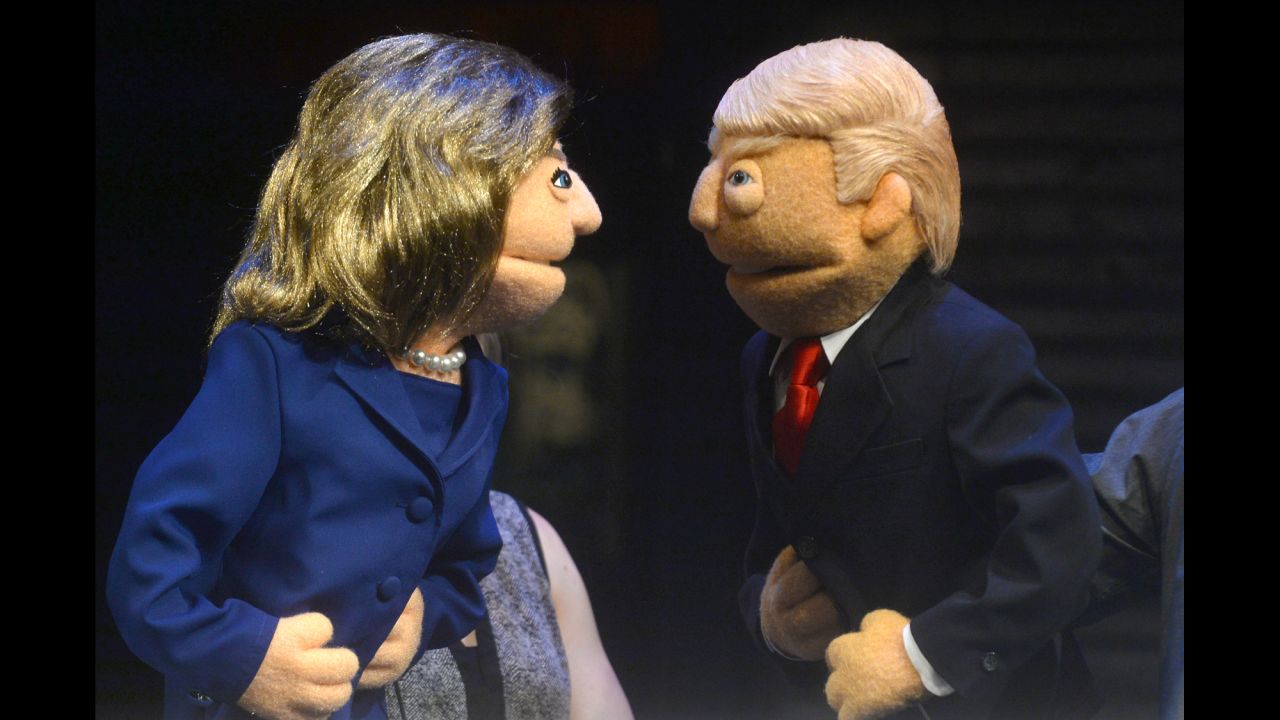 Puppets of Hillary Clinton and Donald Trump face off in a town-hall event in New York on Monday, September 26.