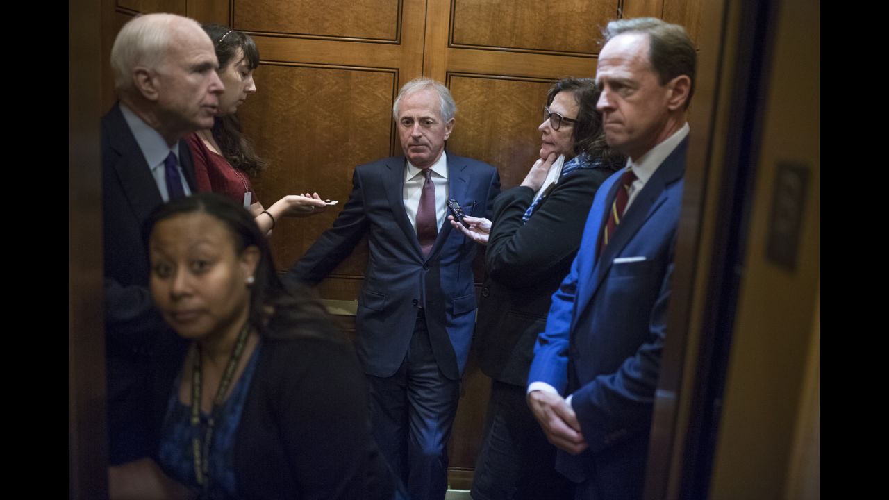 From left, U.S. Sens. John McCain, Bob Corker and Pat Toomey ride a Capitol elevator on Wednesday, September 28.
