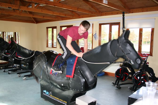 These days, jockeys in the UK are required to pass a fitness test in order to receive their racing license. Here, reigning <a href="index.php?page=&url=http%3A%2F%2Fwww.britishchampionsseries.com" target="_blank" target="_blank">Stobart Champion Apprentice Jockey</a>, Tom Marquand, demonstrates an exercise on a mechanical horse.