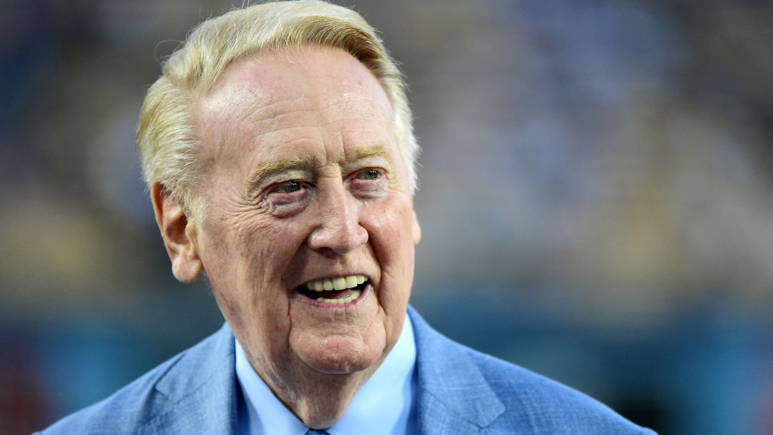 Los Angeles Dodgers broadcaster Vin Scully smiles on the field before the game against the Arizona Diamondbacks at Dodger Stadium on September 23, 2015 in Los Angeles, California.