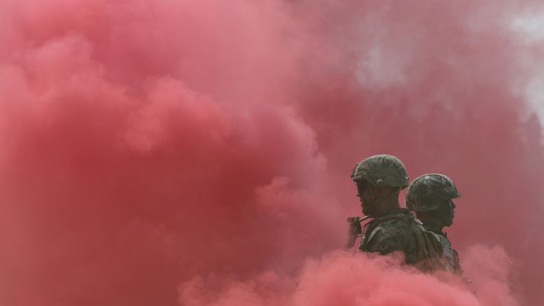 A U.S. Marine and a South Korean Marine stand in smoke during a ceremony in Incheon, South Korea, on Friday, September 9. The ceremony was commemorating the Battle of Incheon, a turning point in the Korean War.
