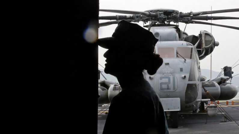 A U.S. Marine is silhouetted on the deck of the USS Bonhomme Richard on Thursday, September 29.