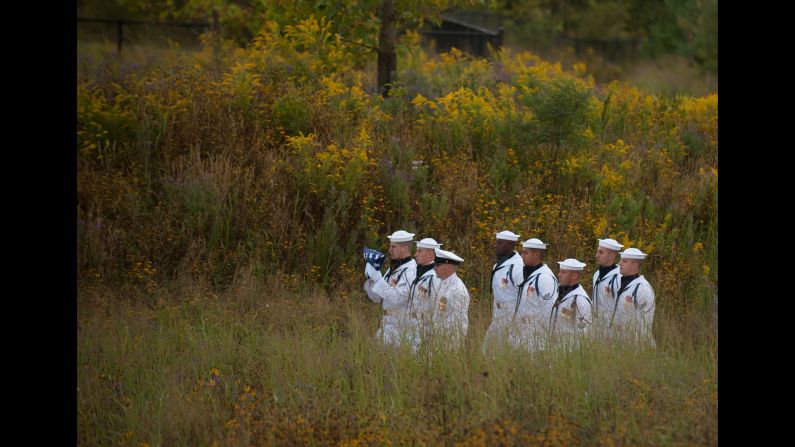 A U.S. Navy honor guard walks with a flag to the Wall of Names at the Flight 93 National Memorial in Shanksville, Pennsylvania, on Sunday, September 11. <a href="http://www.cnn.com/2016/09/11/us/gallery/911-15th-anniversary/index.html" target="_blank">See more memorials from the 15th anniversary of the 9/11 attacks</a>