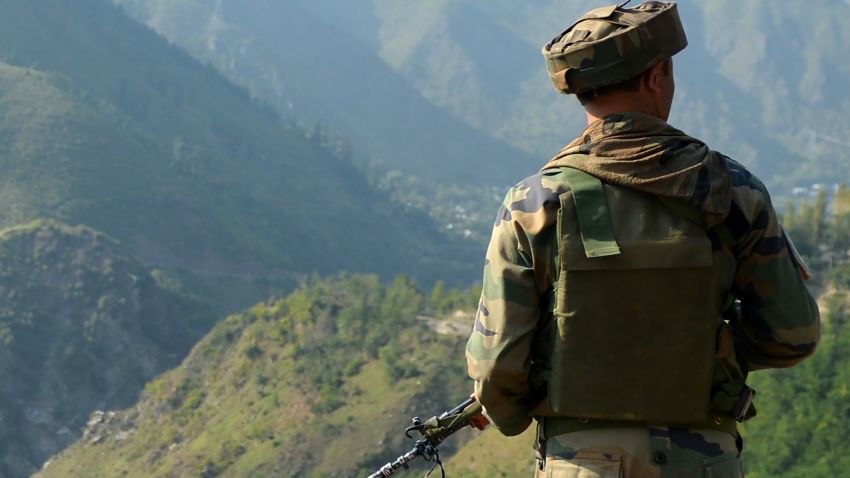 An Indian army soldier looks towards the site of a gunbattle between Indian army soldiers and rebels inside an army brigade headquarters near the border with Pakistan, known as the Line of Control (LoC), in Uri on September 18, 2016.
Militants armed with guns and grenades killed 17 soldiers in a raid September 18 on an army base in Indian-administered Kashmir, the worst such attack for more than a decade in the disputed Himalayan region. / AFP / TAUSEEF MUSTAFA        (Photo credit should read TAUSEEF MUSTAFA/AFP/Getty Images)