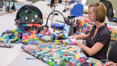 Whitney Lowery, a NASA space suit technician with ILC Dover, works on sewing art pieces to build the children's space suit replicas for the project. The art pieces will be combined to create the space suit replica call Unity. 