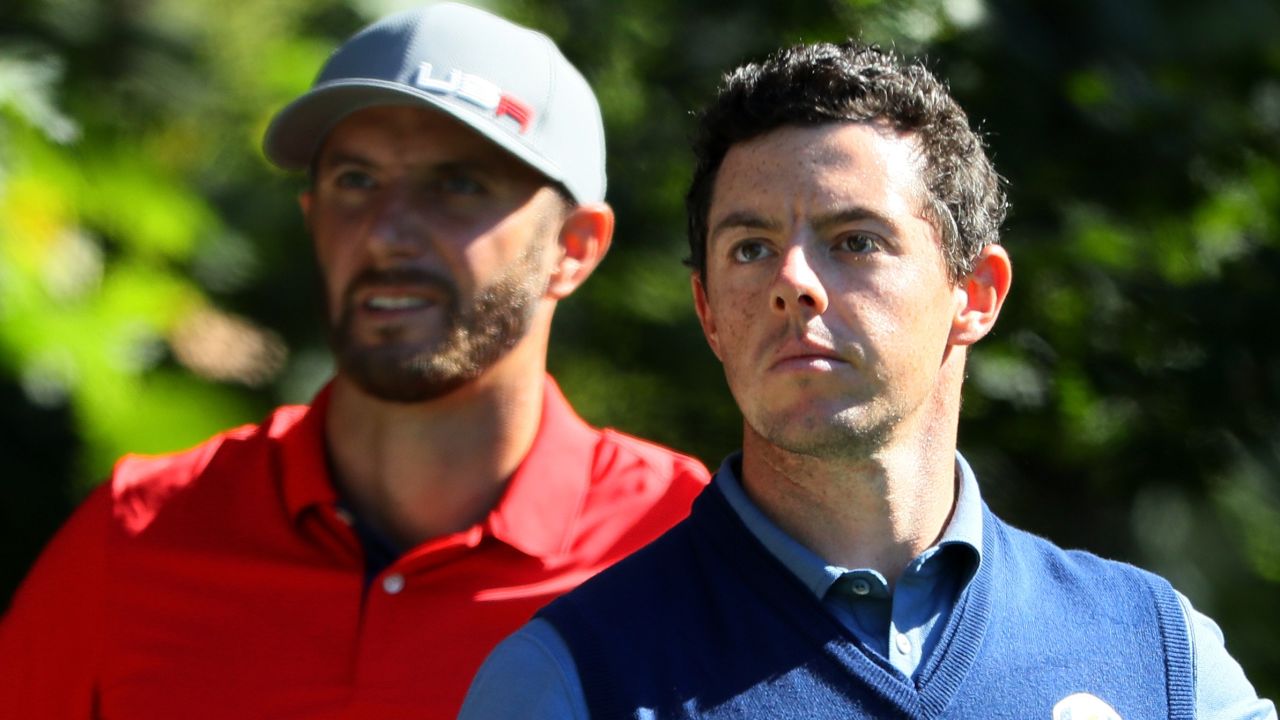 CHASKA, MN - SEPTEMBER 30: Dustin Johnson of the United States looks on as Rory McIlroy of Europe hits off the fifth tee during afternoon fourball matches of the 2016 Ryder Cup at Hazeltine National Golf Club on September 30, 2016 in Chaska, Minnesota.  (Photo by Andrew Redington/Getty Images)