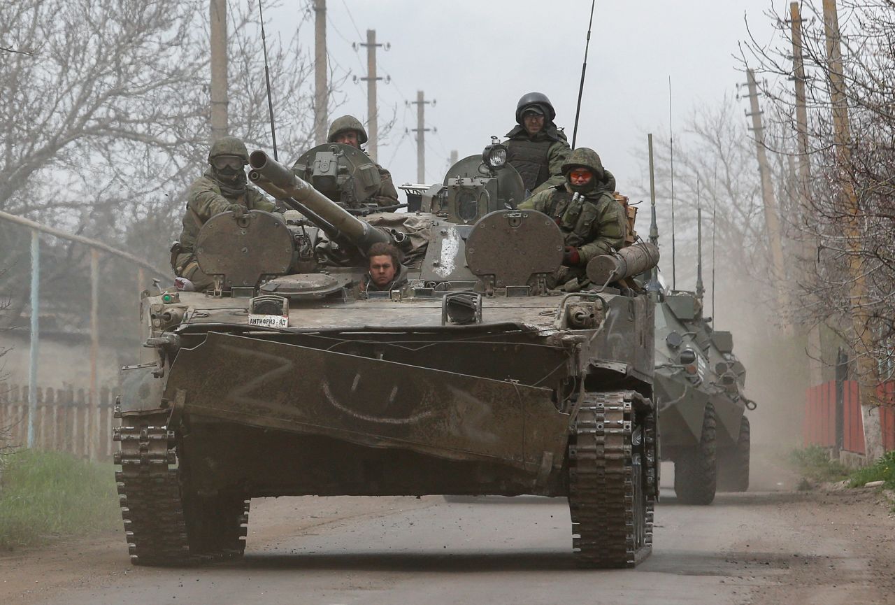 Service members of pro-Russian troops sit atop of an armoured vehicle en route to the southern port city of?Mariupol, Ukraine, on April 17.