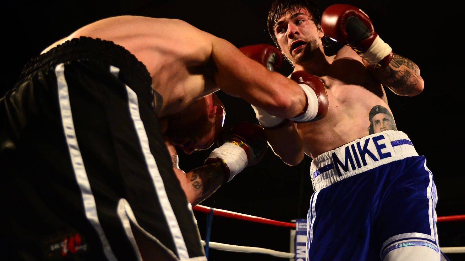 Boxer Mike Towell, right, takes on Danny Little in a 2015 welterweight match in Glasgow, Scotland.