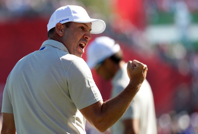 Sergio Garcia of Europe reacts after sinking a putt on the 17th hole. 