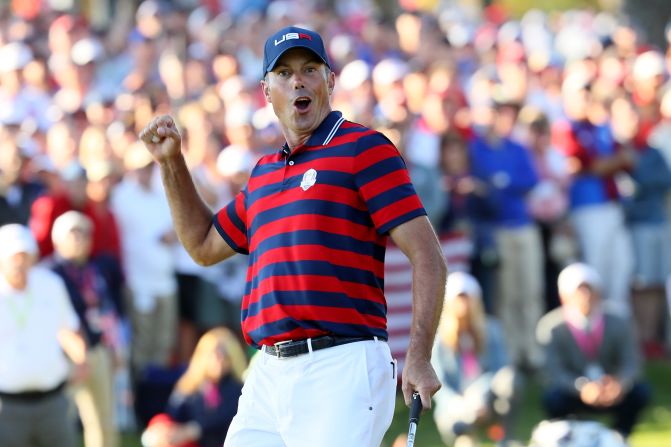 Matt Kuchar of the United States celebrates after sinking a  putt on the 13th green during afternoon fourball matches of the 2016 Ryder Cup.